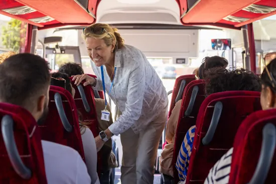 A man and a woman discussing in a Bus provided by Europe Bus Reservation